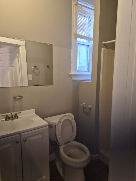Shared living unit: clean bathroom with vanity and window
