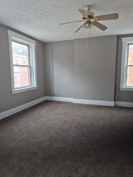 Shared living unit: spacious room with large windows