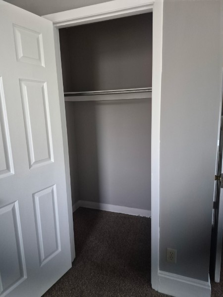 Shared living unit: closet with shelf and hanging space
