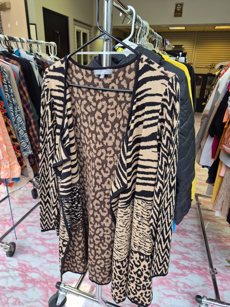 Patterned cardigan on rack in the clothing closet